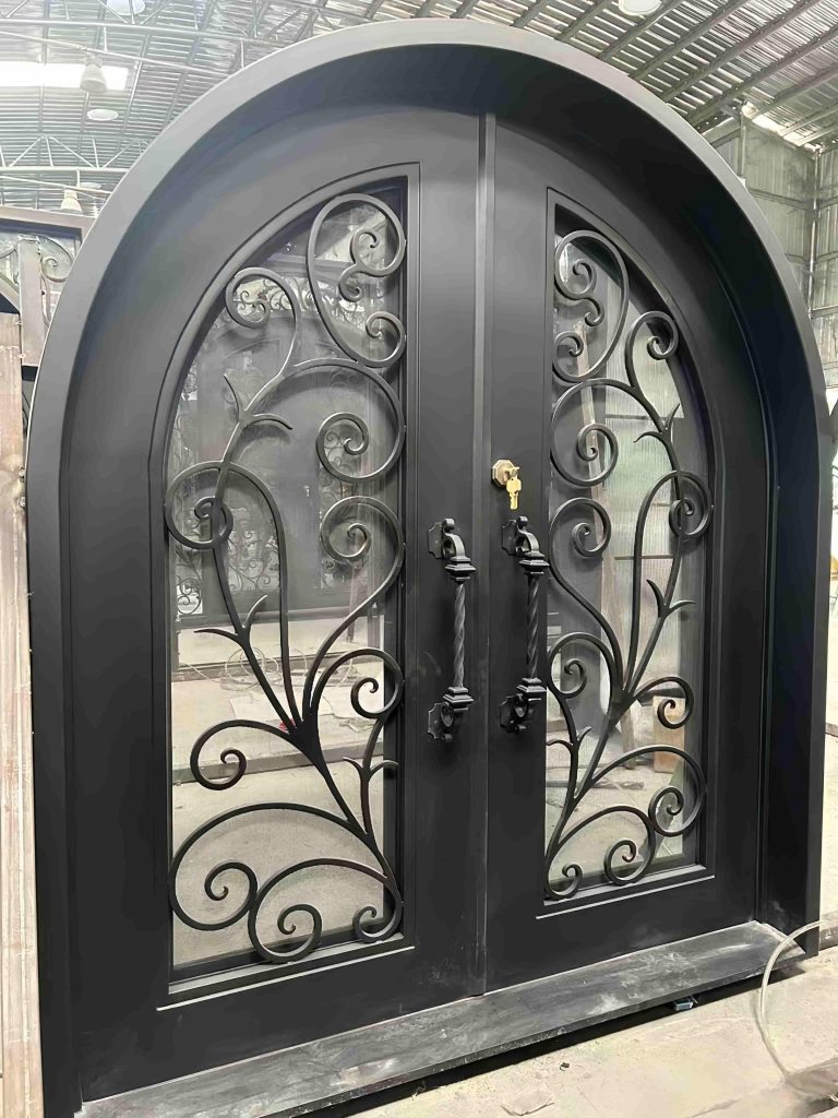 Custom large black arch gate with hand-forged wrought iron frame and cathedral-style silhouette – luxury villa arched entrance