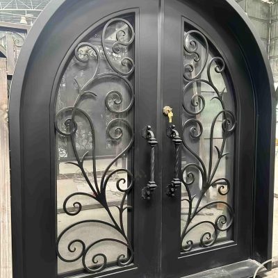 Custom large black arch gate with hand-forged wrought iron frame and cathedral-style silhouette – luxury villa arched entrance