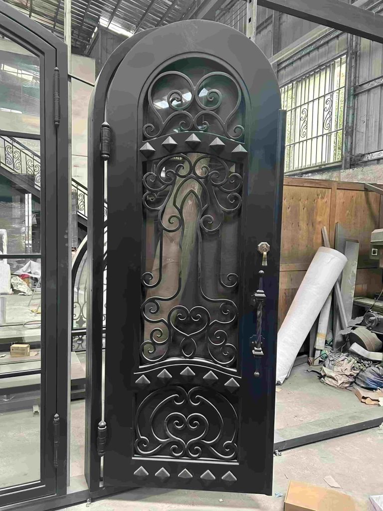 Custom black wrought iron entry door with hand-forged scrollwork and matte finish – luxury villa front entrance