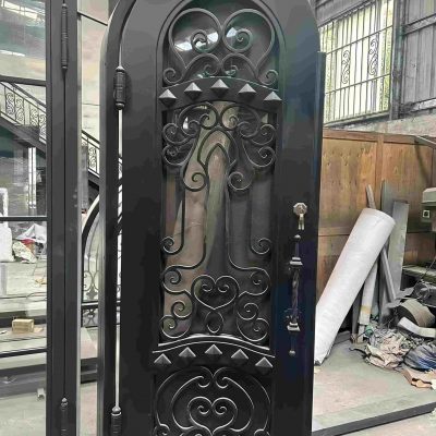 Custom black wrought iron entry door with hand-forged scrollwork and matte finish – luxury villa front entrance