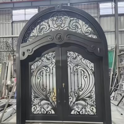 Custom black villa gate with hand-forged wrought iron panels and matte finish – luxury estate entrance
