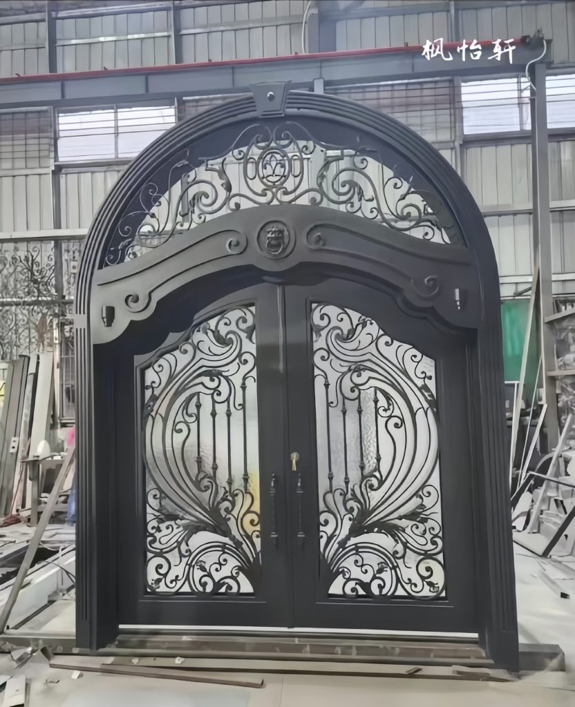 Custom black villa gate with hand-forged wrought iron panels and matte finish – luxury estate entrance
