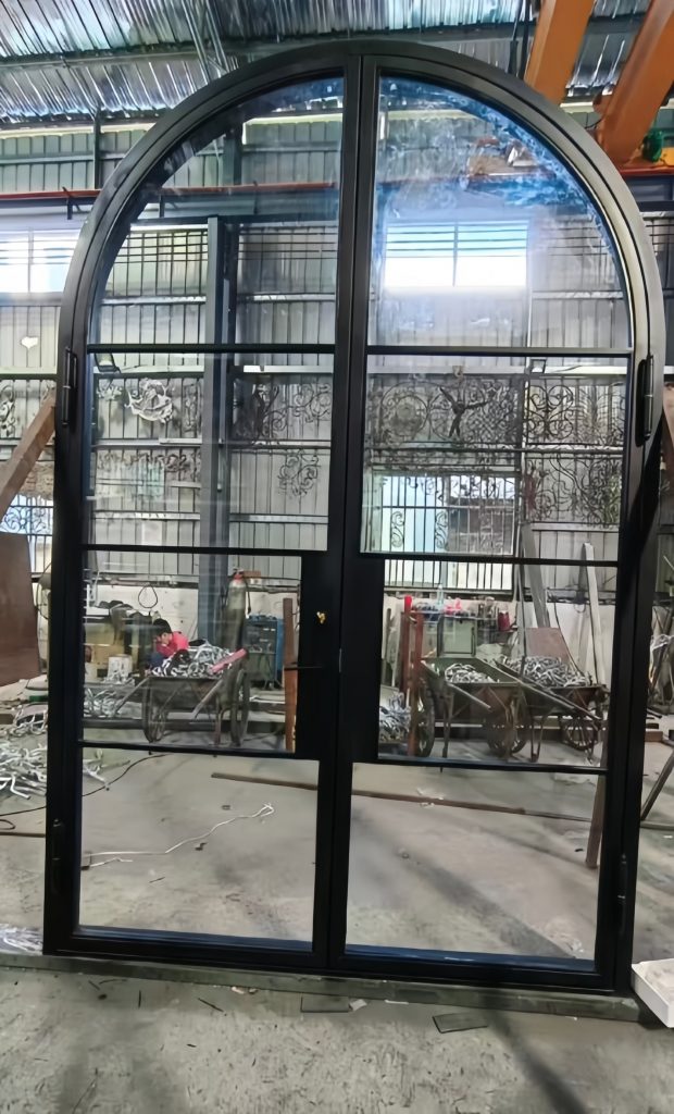 Custom wrought iron glass door with hand-forged frame and clear tempered glass panels – luxury villa entrance