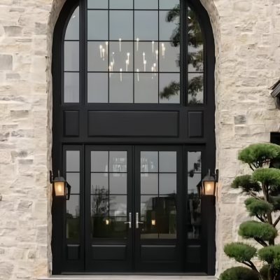 Elegant arched entryway with large windows in a stone building