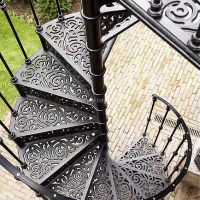 Top-down view of a black wrought iron spiral staircase showing circular opening and handrail