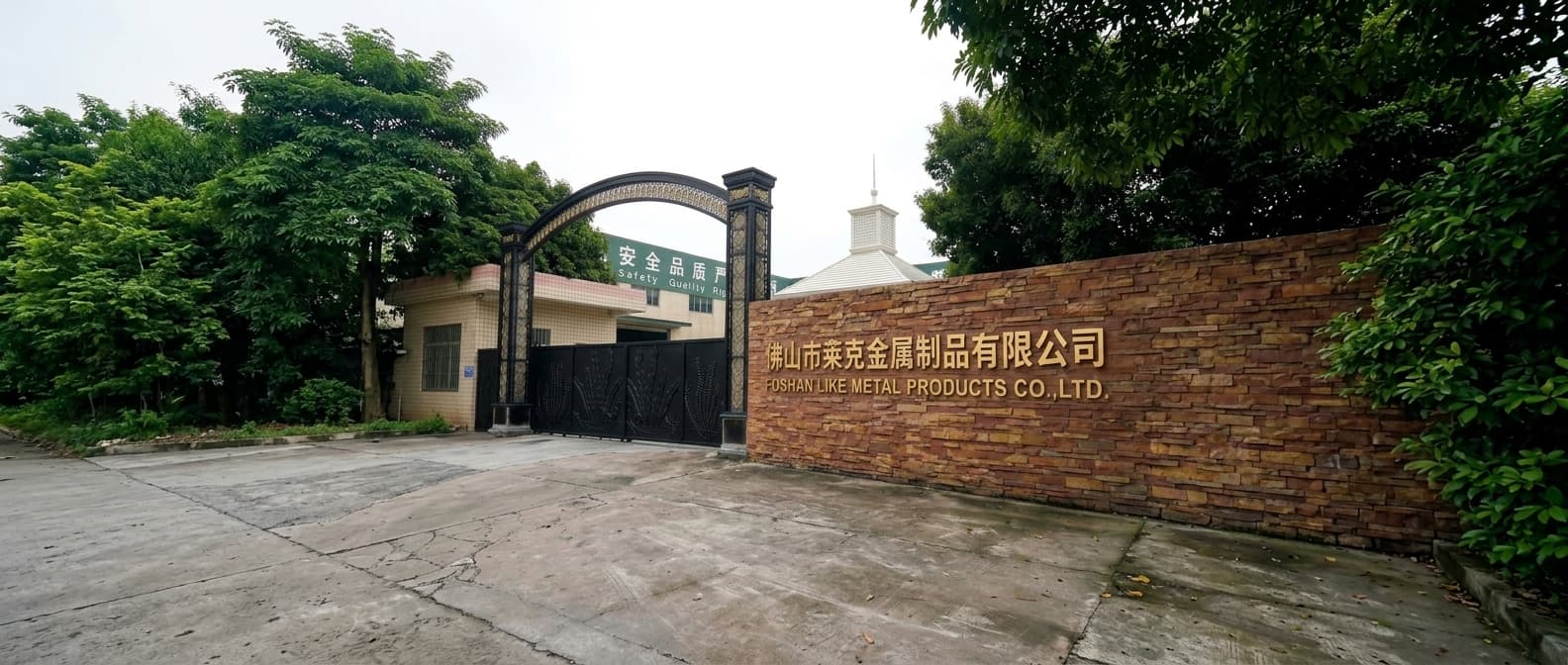 Spacious LIKE Metal factory workshop with advanced metal fabrication machinery, skilled workers operating production lines, and rows of wrought iron gates, table legs, and staircase components in various stages of manufacturing.