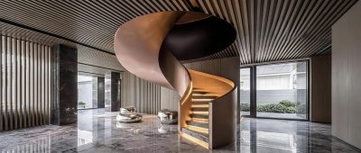 LIKE Metal manufacturing facility specializing in custom metal staircases, with skilled welders fabricating steel stringers, wrought iron balusters, and handrails for residential and commercial stair projects.